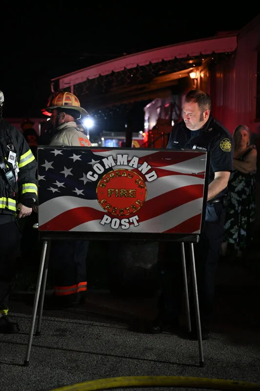 Fire command post board set up on scene of a nighttime fire response
