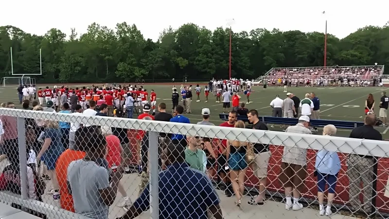 Crowd and players at a community football event