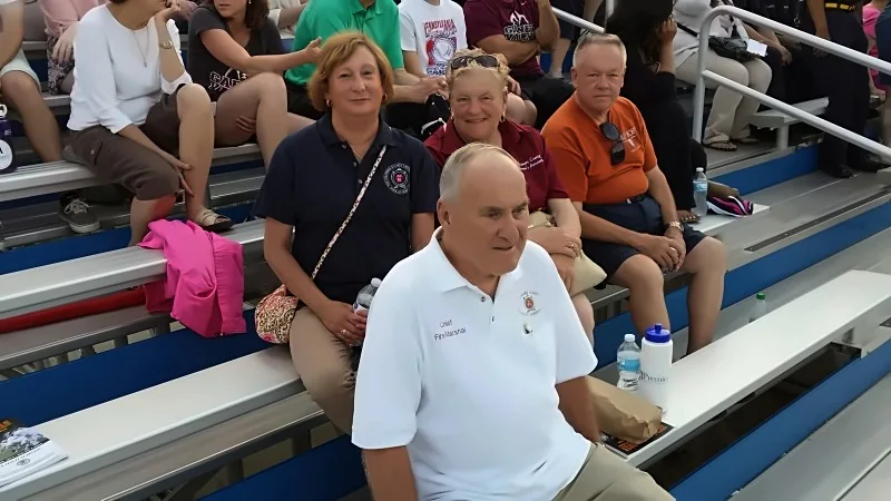 Attendees seated in the bleachers at a DCFA community event